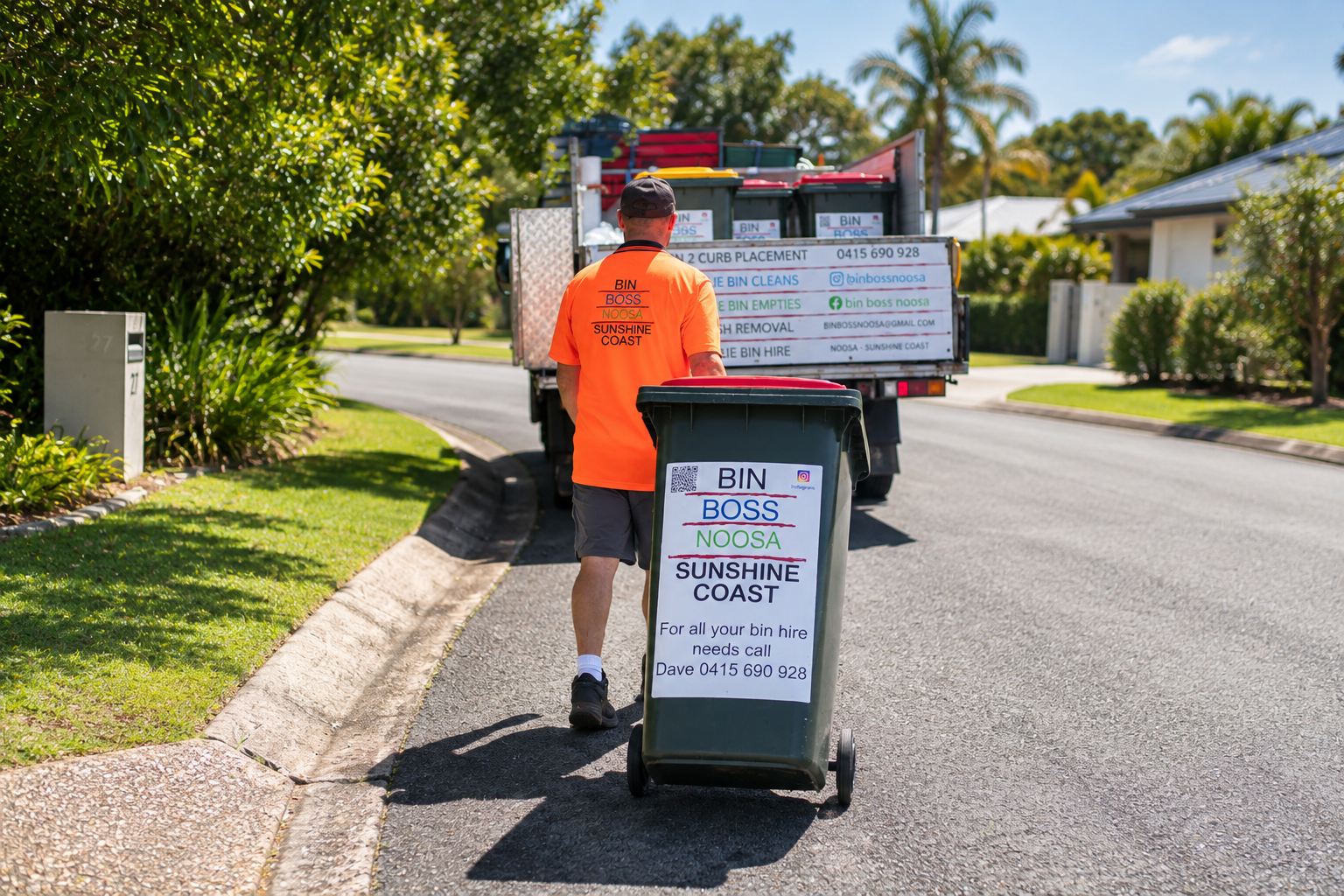 David wheeling a bin toward the Bin Boss truck on a Sunshine Coast street